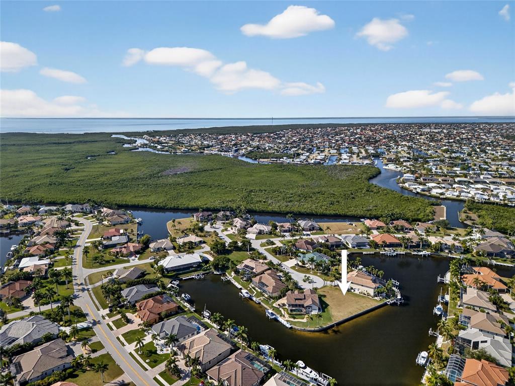 an aerial view of a residential houses with outdoor space