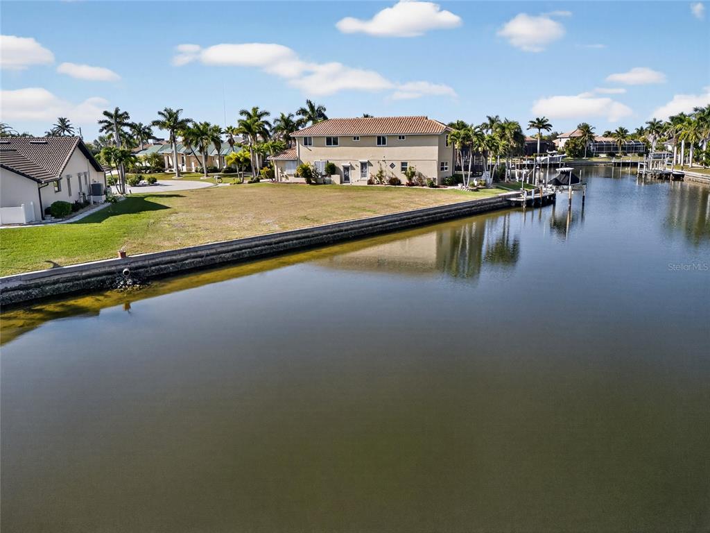 600 Candia Court Punta Gorda, FL 33950 - Photo 11 of 12 a view of a lake with boats and trees