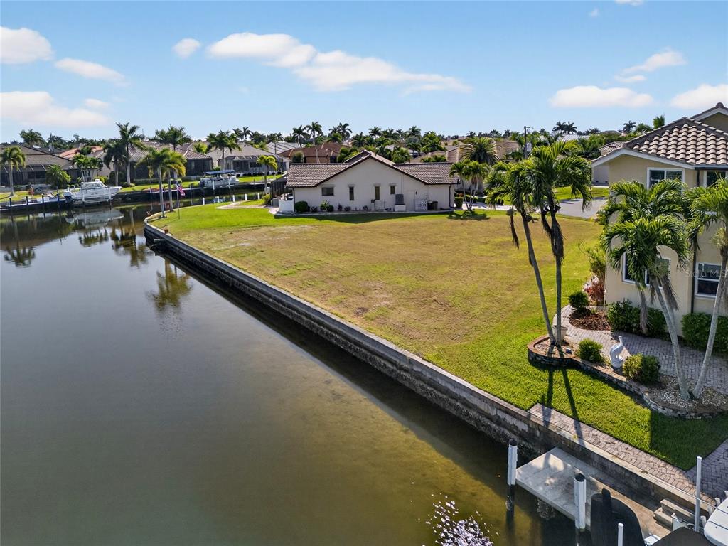 600 Candia Court Punta Gorda, FL 33950 - Photo 12 of 12 a view of a swimming pool with chairs