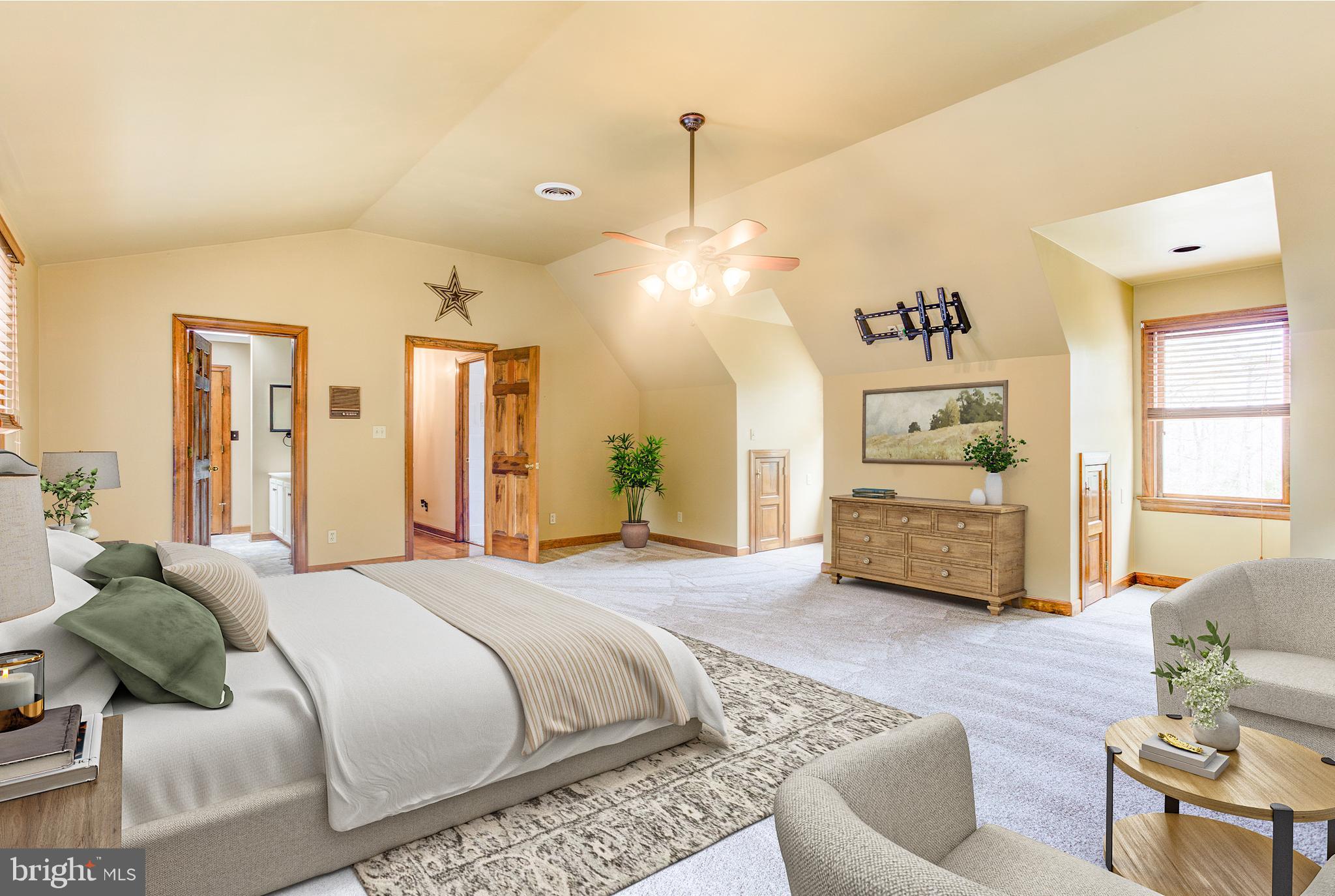 12117 Salem Church Road King George, VA 22485 - Photo 17 of 34 a spacious bedroom with a bed a couch and dresser
