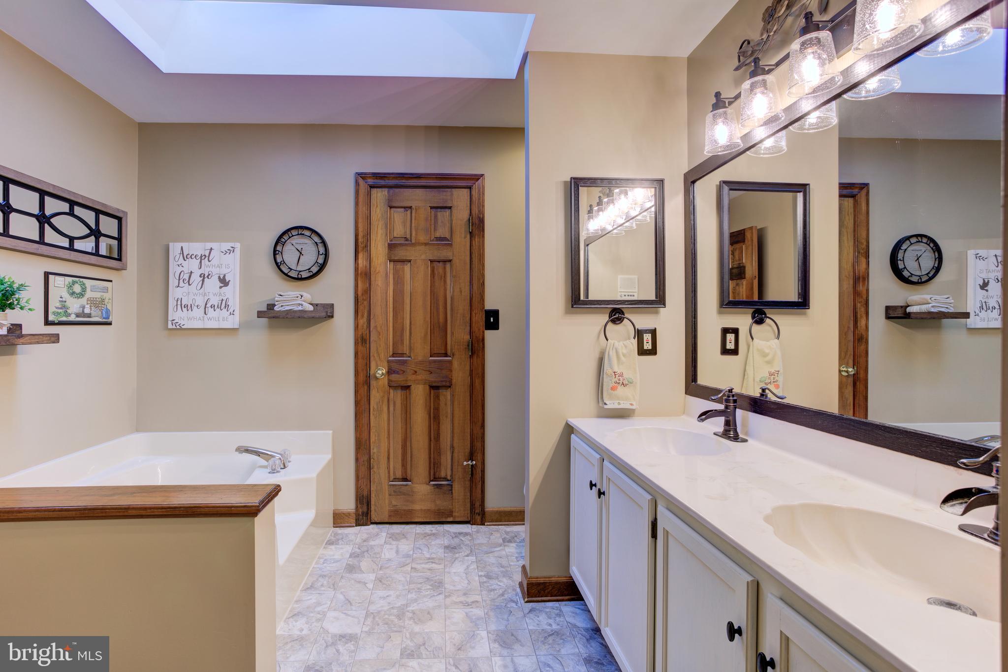 12117 Salem Church Road King George, VA 22485 - Photo 18 of 34 a bathroom with a sink a mirror and a shower