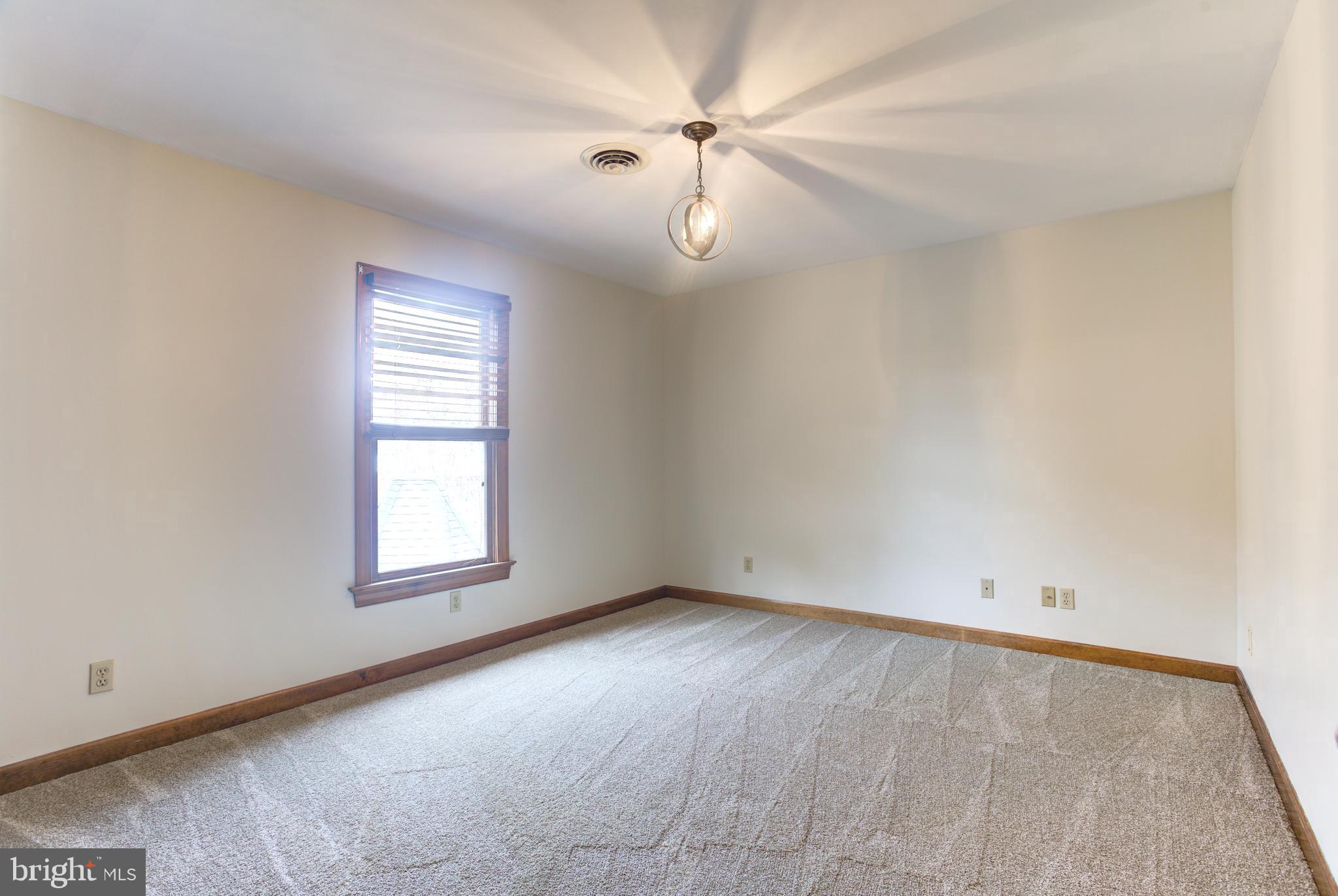 12117 Salem Church Road King George, VA 22485 - Photo 24 of 34 an empty room with windows and fan