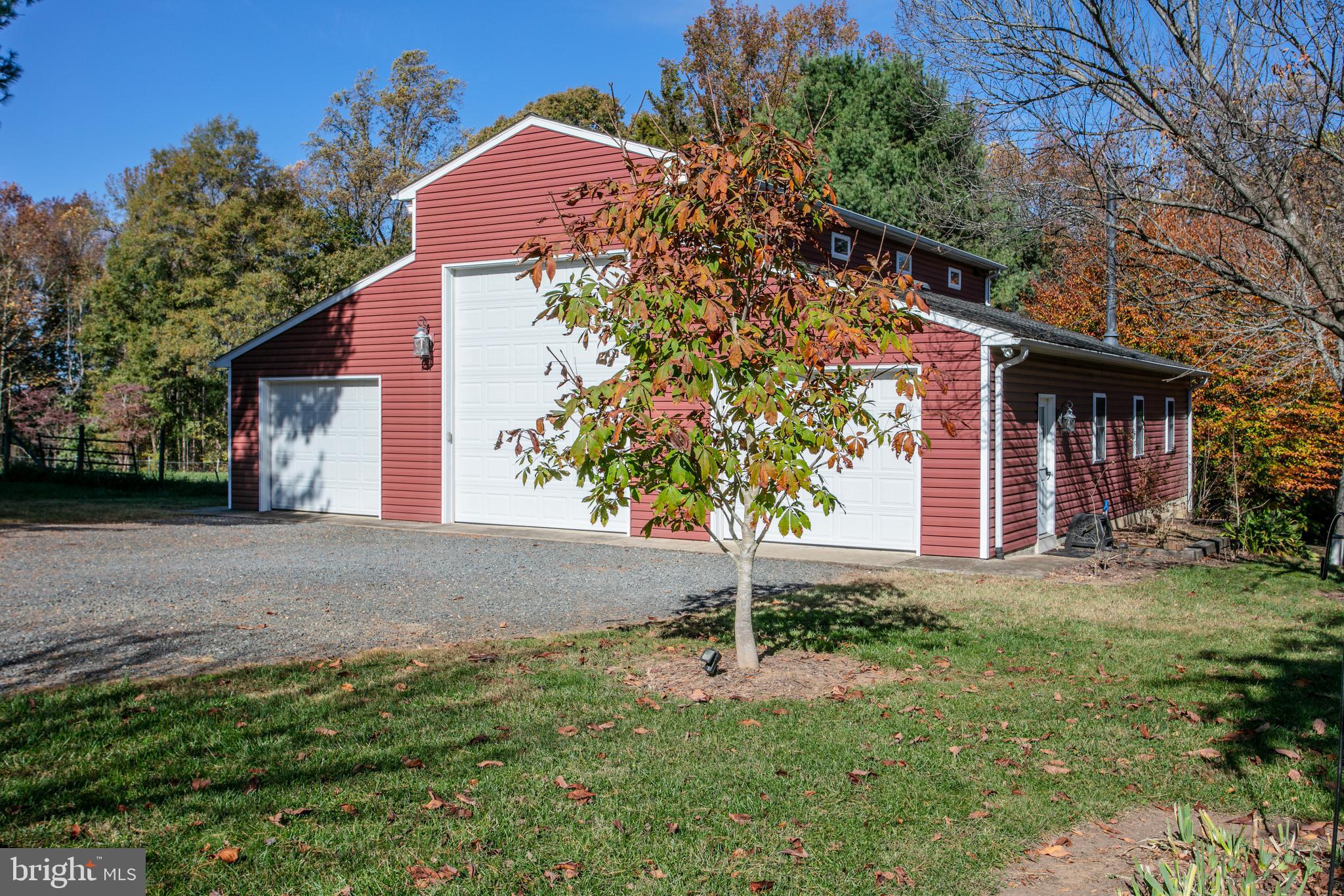 12117 Salem Church Road King George, VA 22485 - Photo 32 of 34 a front view of a house with a yard and garage