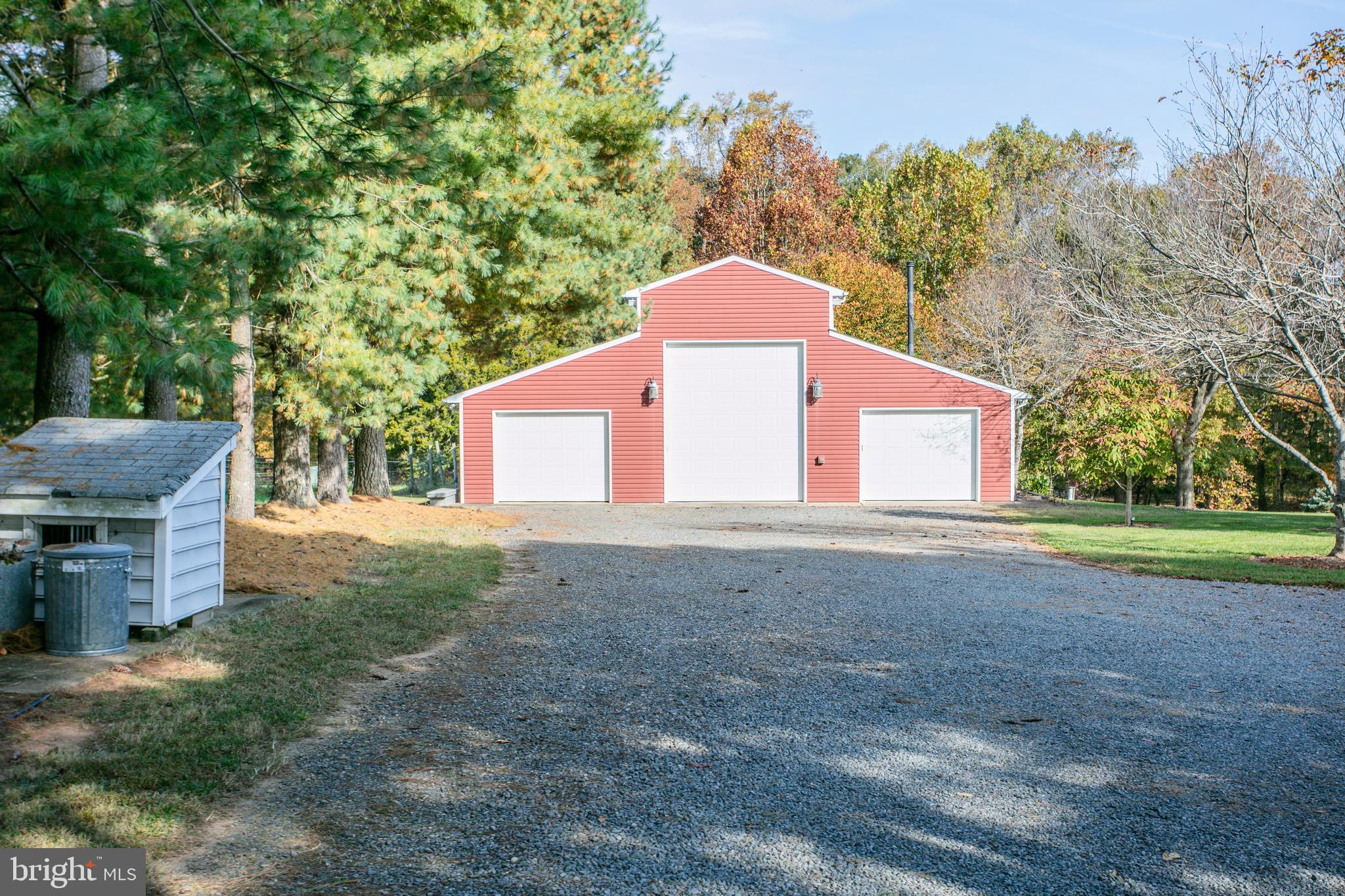 12117 Salem Church Road King George, VA 22485 - Photo 6 of 34 a front view of a house with a yard and garage
