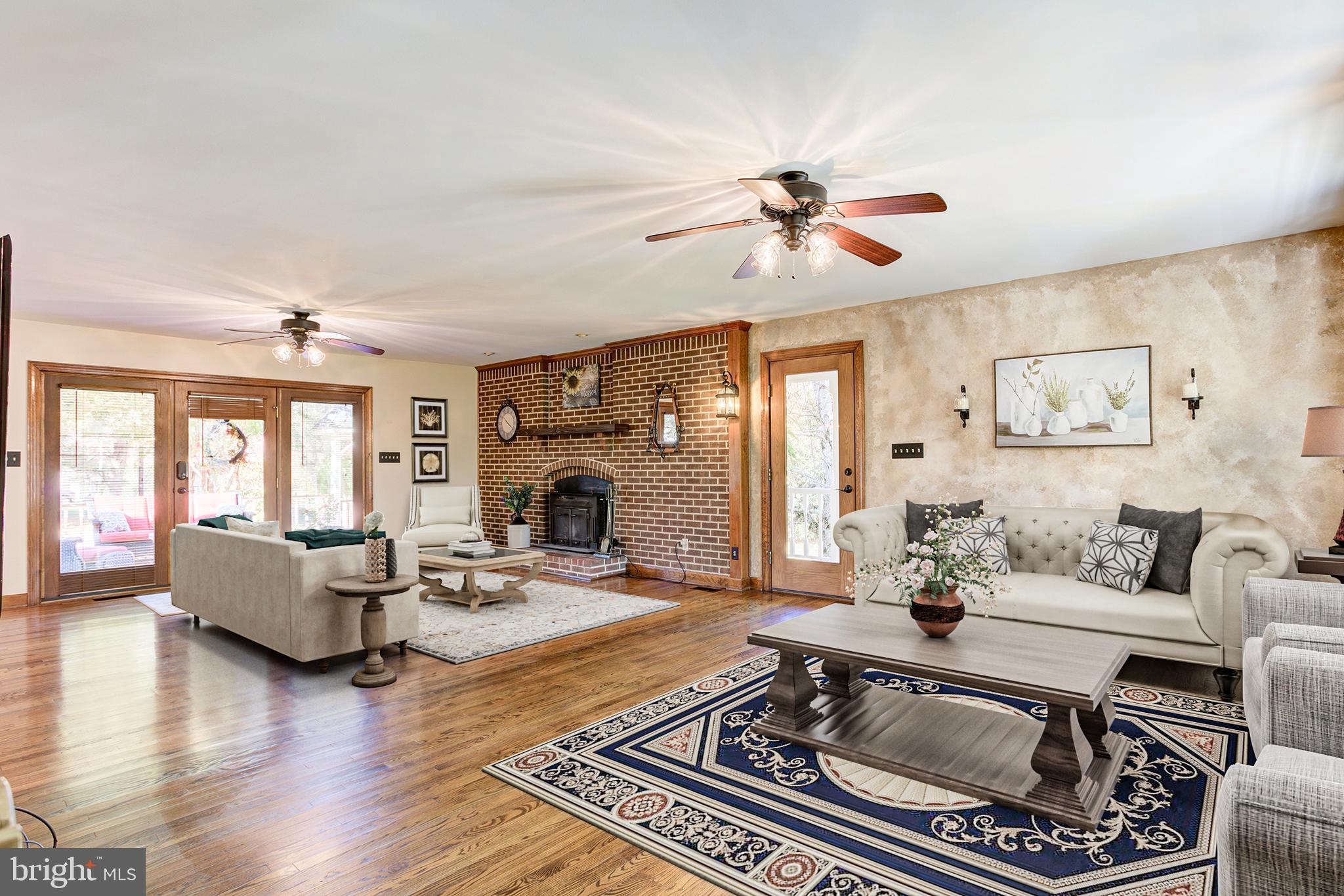 12117 Salem Church Road King George, VA 22485 - Photo 8 of 34 a living room with furniture fireplace and a large window