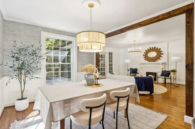a dining room with furniture and window