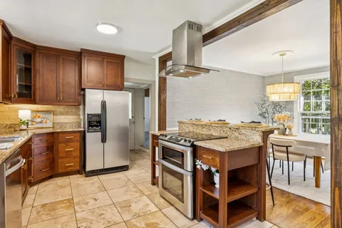 a kitchen with a table and chairs in it