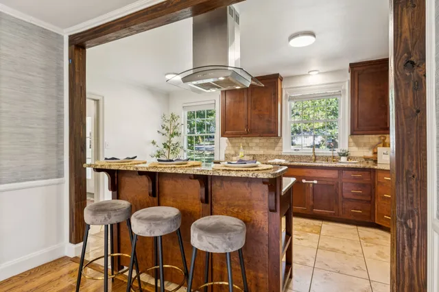 a kitchen with stainless steel appliances a sink and cabinets