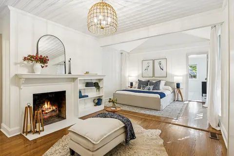 a living room with furniture and large window