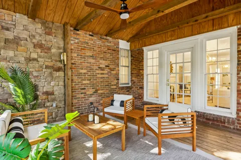 a backyard of a house with seating space