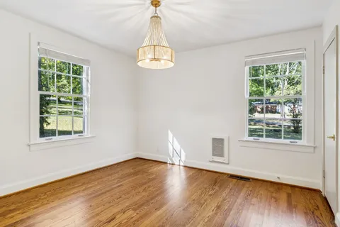 a view of balcony with wooden floor