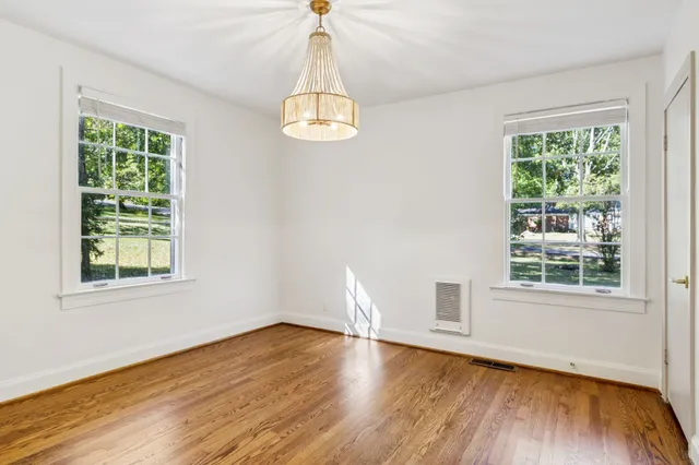 a view of balcony with wooden floor