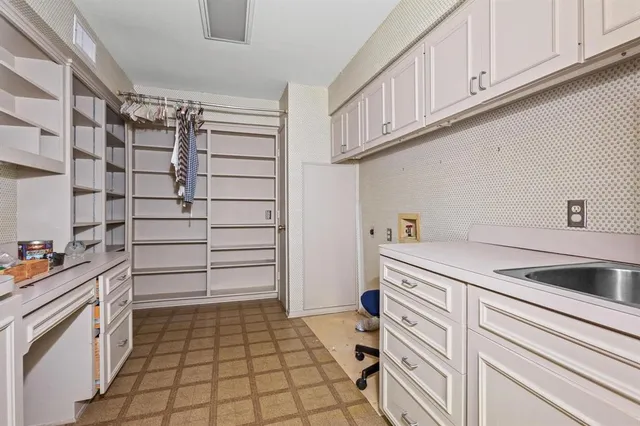 a kitchen with a cabinets and appliances