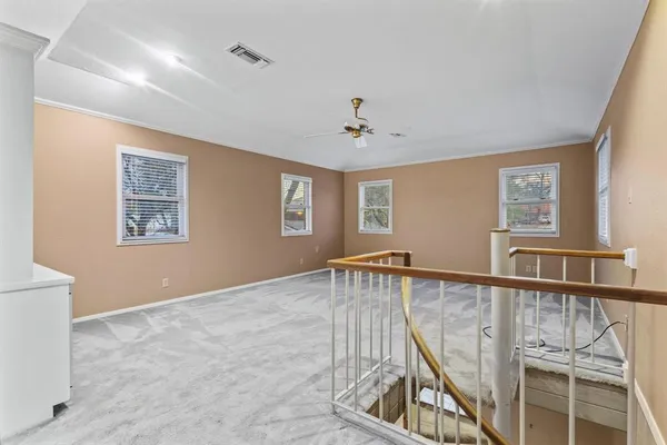 a view of an empty room with windows