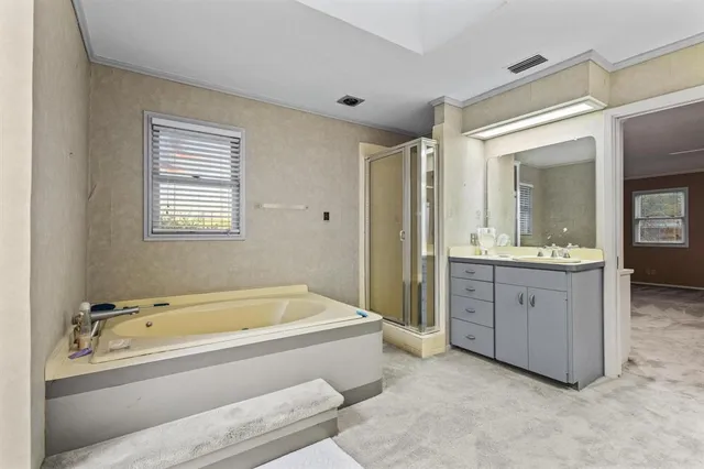 a bathroom with bathtub sink and mirror