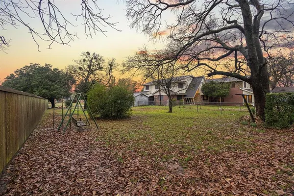 a backyard of a house with lots of green space
