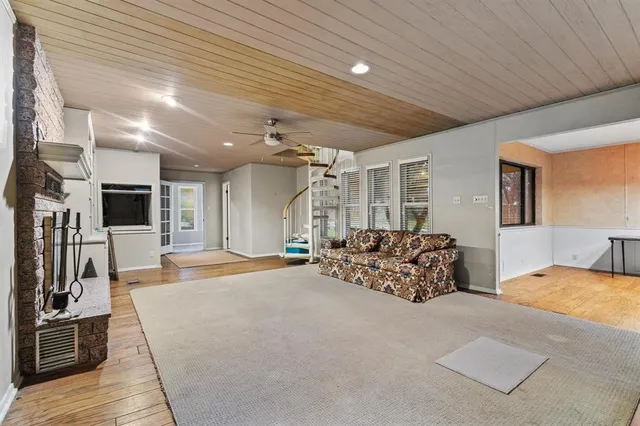 a bed room with furniture and a flat screen tv