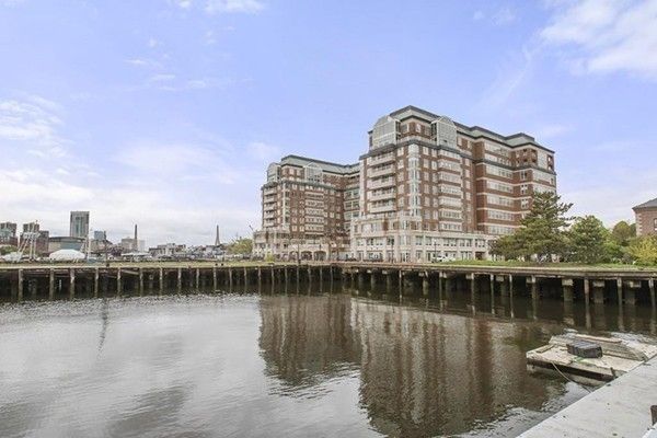 a view of a large building with a lake