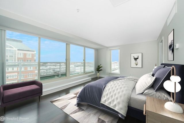 a bedroom with a bed and glass window