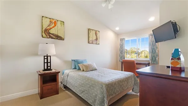 a bedroom with a bed and dresser