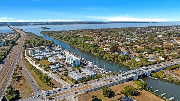 an aerial view of a residential houses with outdoor space