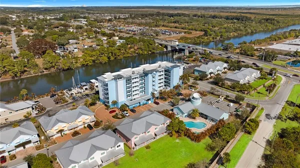 an aerial view of a house with a swimming pool