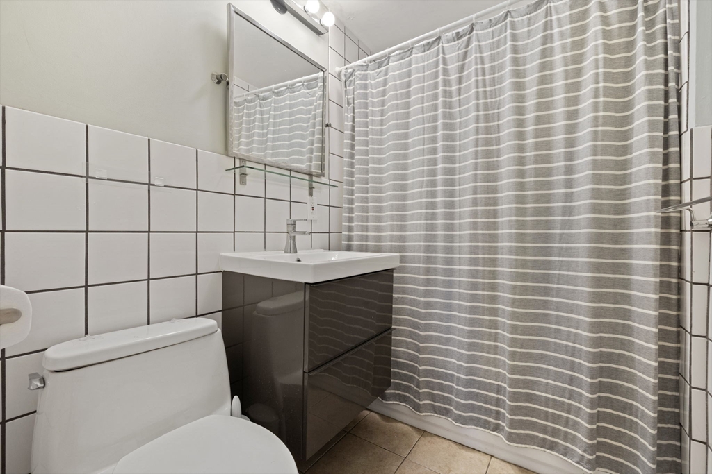 39 Englewood Avenue, Unit 17 Boston, MA 02135 - Photo 9 of 14 a bathroom with a sink and toilet
