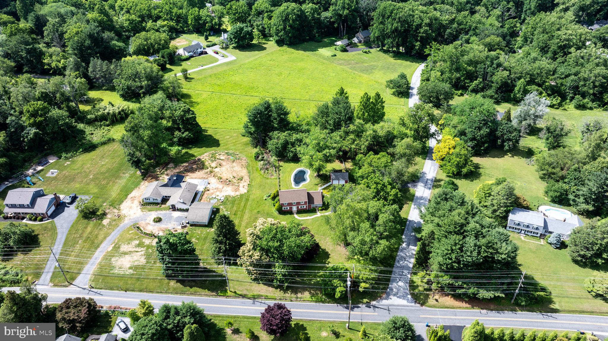 1929 Hillendale Road Chadds Ford, PA 19317 - Photo 16 of 56 an aerial view of residential houses with outdoor space and trees all around