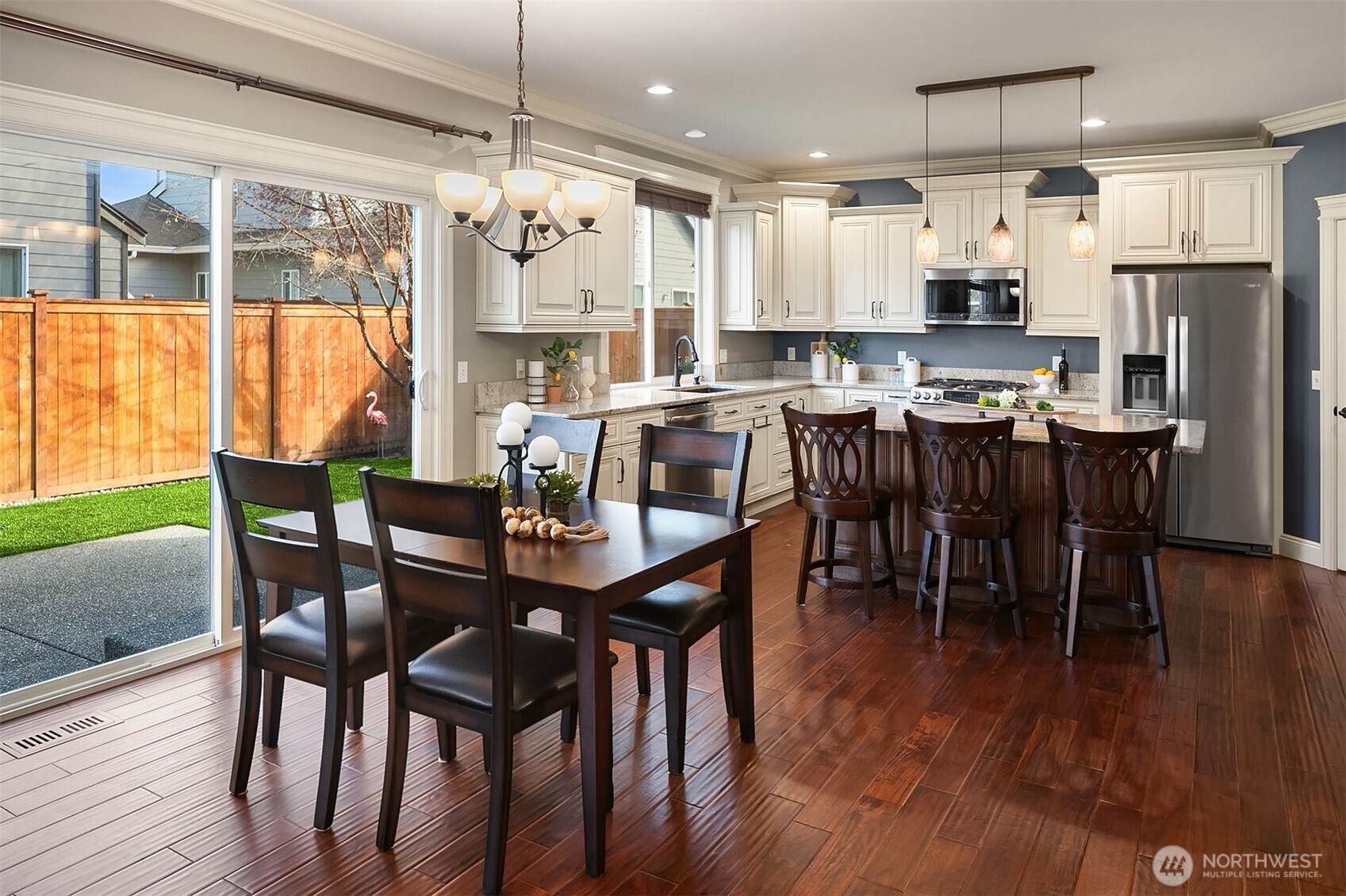 22632 Southeast 281st Street Maple Valley, WA 98038 - Photo 11 of 24 a view of a dining room with furniture window and wooden floor