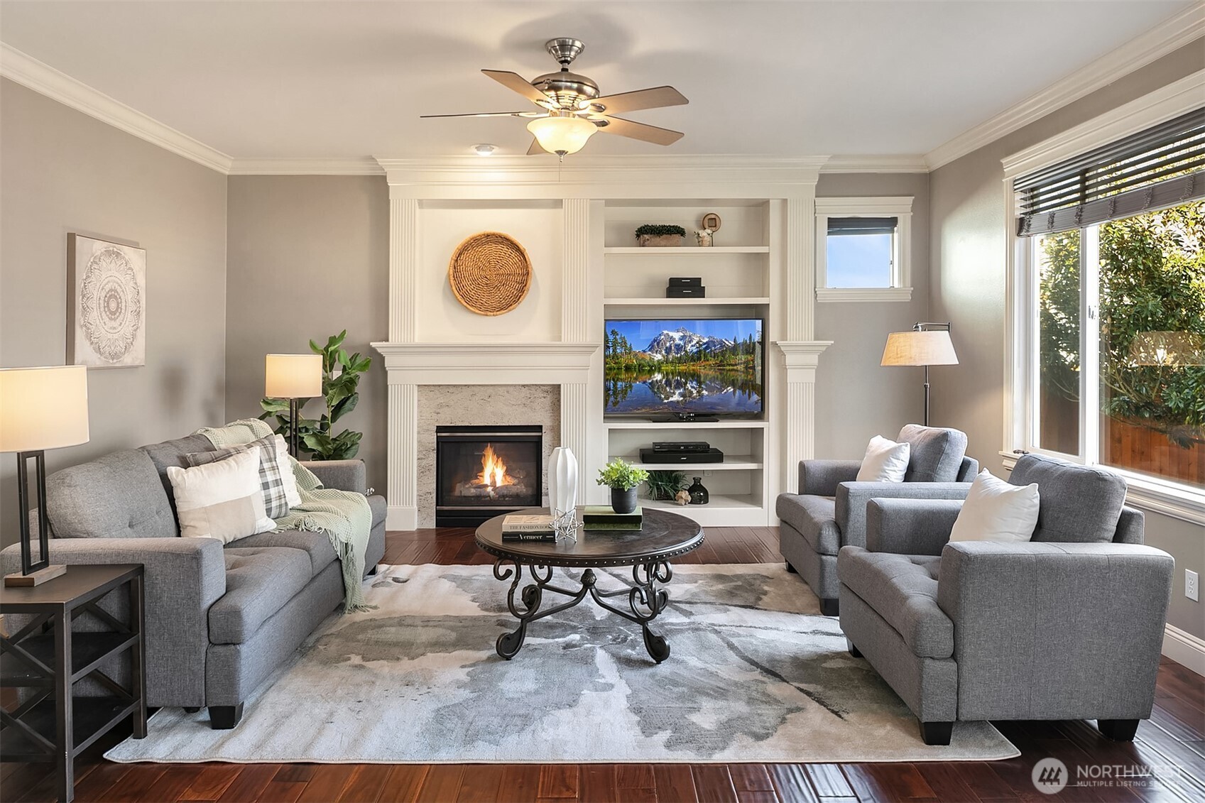 22632 Southeast 281st Street Maple Valley, WA 98038 - Photo 12 of 24 a living room with furniture and a fireplace