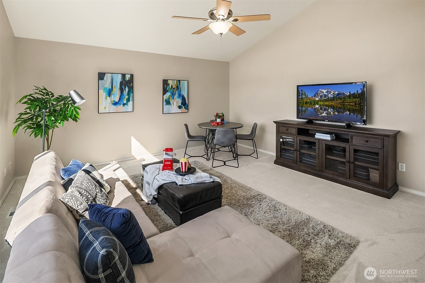 22632 Southeast 281st Street Maple Valley, WA 98038 - Photo 15 of 24 a living room with furniture and a flat screen tv