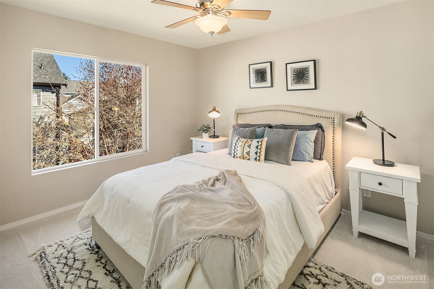 22632 Southeast 281st Street Maple Valley, WA 98038 - Photo 19 of 24 a bedroom with a large bed and a window