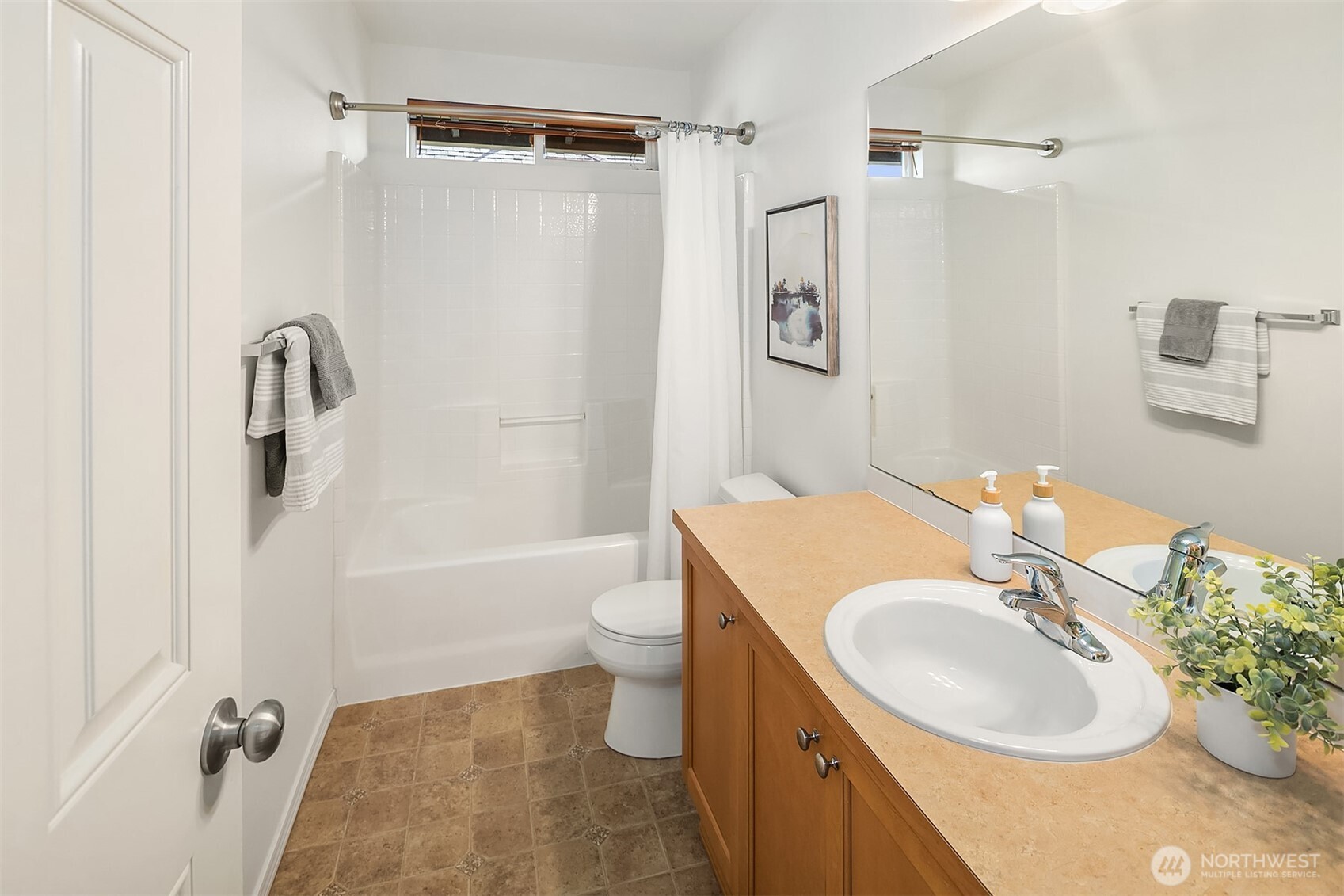 22632 Southeast 281st Street Maple Valley, WA 98038 - Photo 21 of 24 a bathroom with a sink toilet and shower
