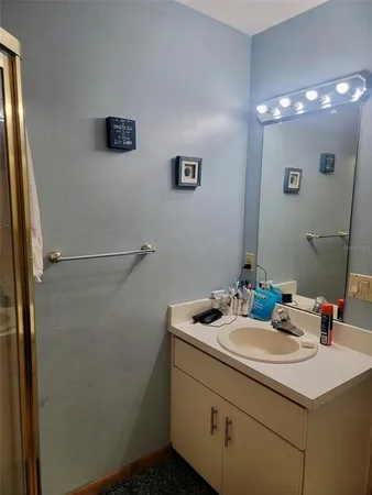 a bathroom with a sink and a mirror
