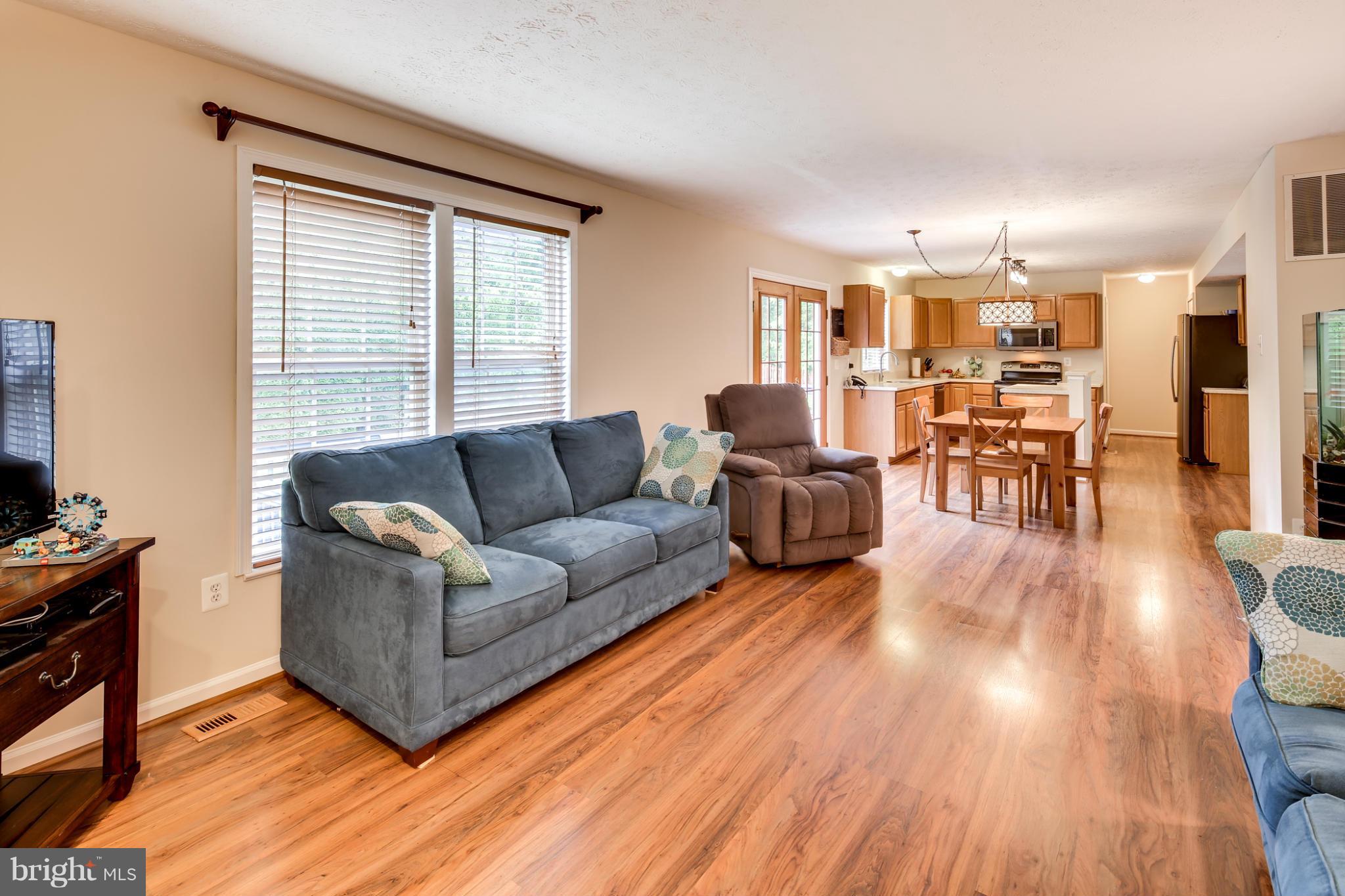 9539 Ridgeview Drive Columbia, MD 21046 - Photo 11 of 30 a living room with furniture and a wooden floor