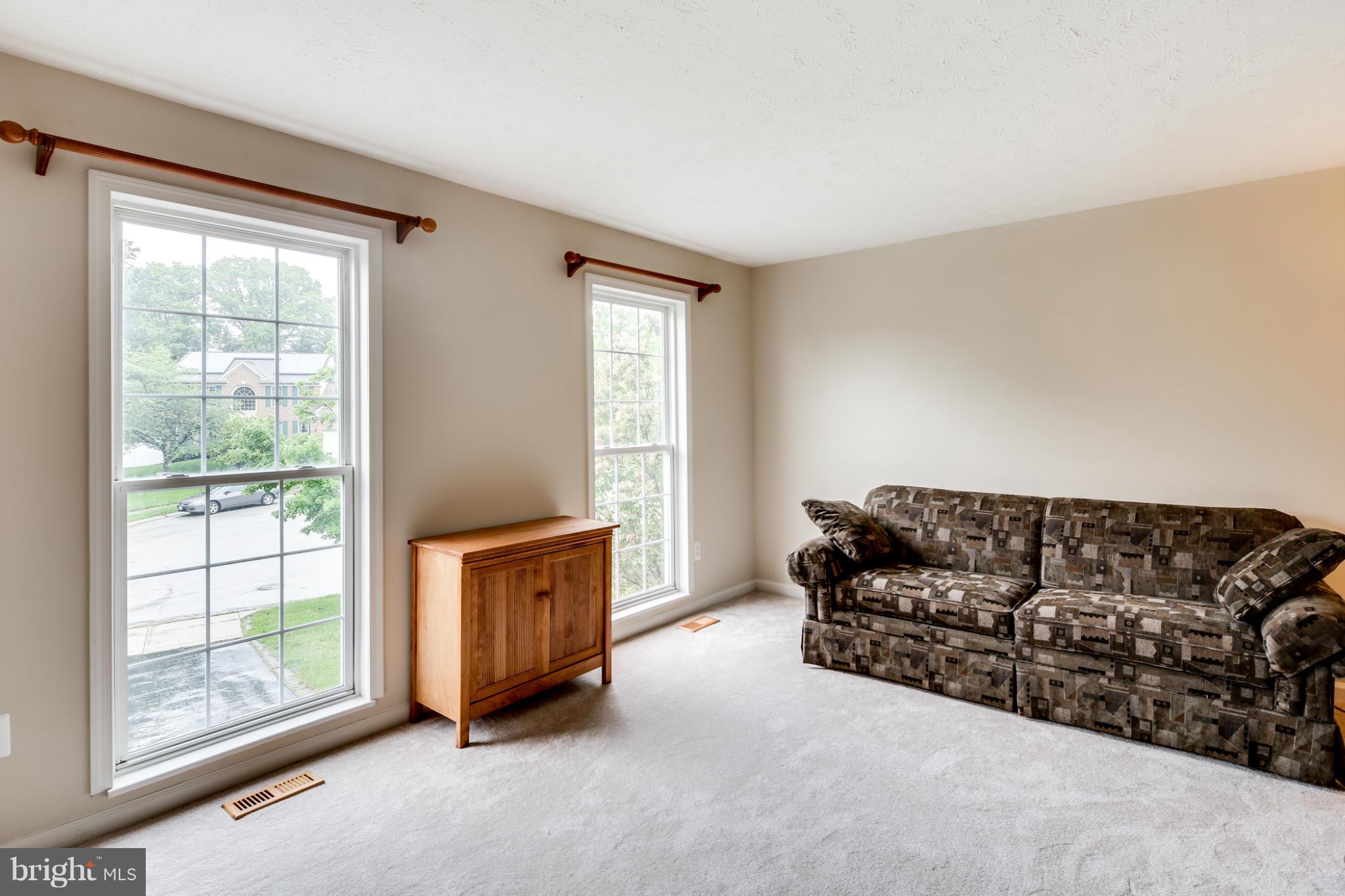 9539 Ridgeview Drive Columbia, MD 21046 - Photo 3 of 30 a living room with furniture and a window