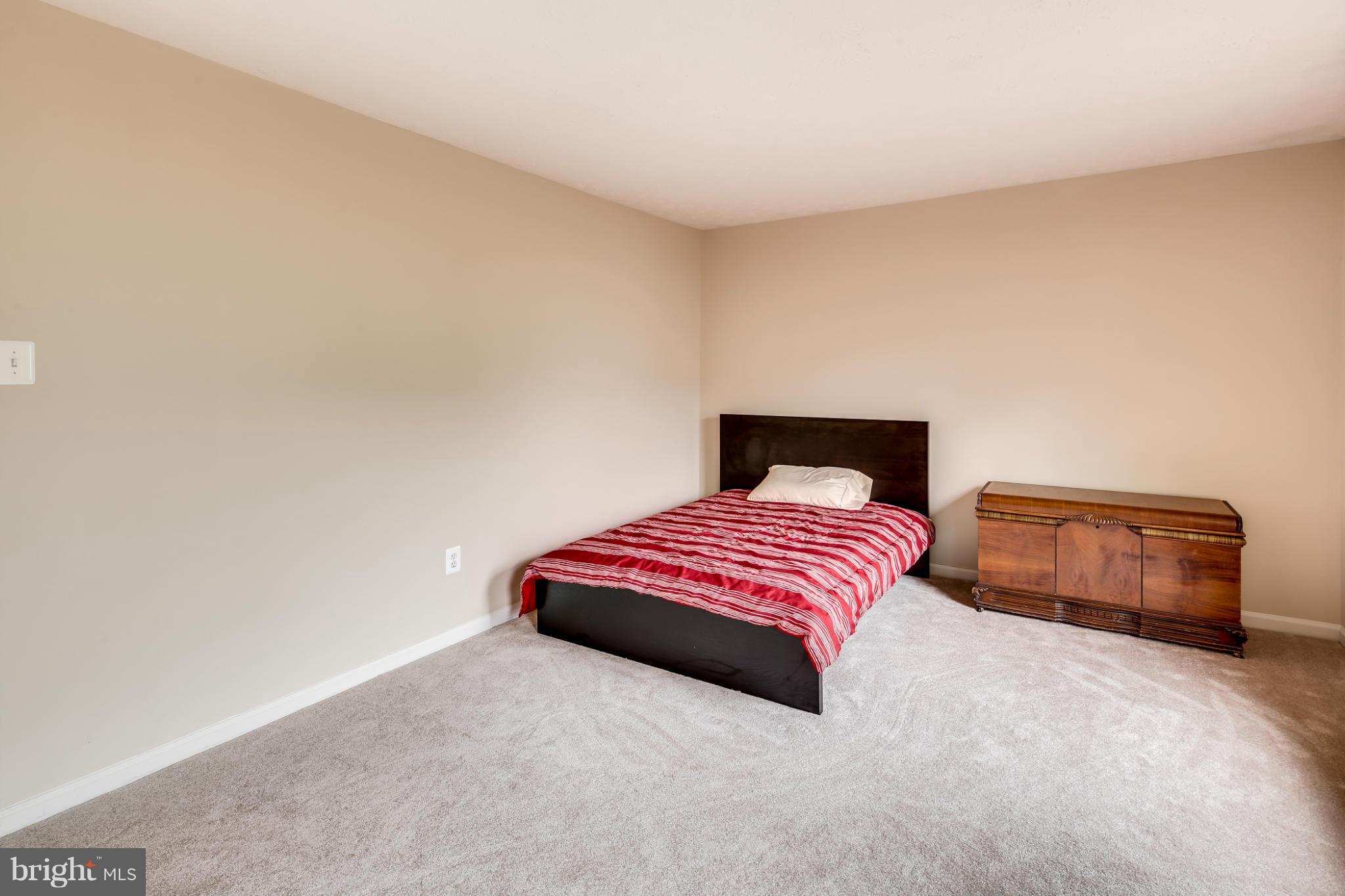 9539 Ridgeview Drive Columbia, MD 21046 - Photo 21 of 30 a bedroom with a bed and a couch