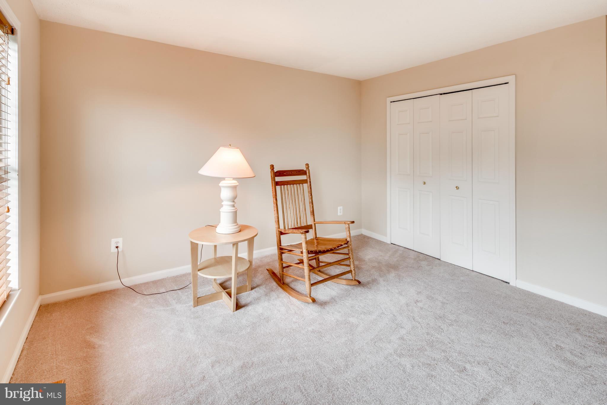 9539 Ridgeview Drive Columbia, MD 21046 - Photo 24 of 30 a living room with furniture and a lamp