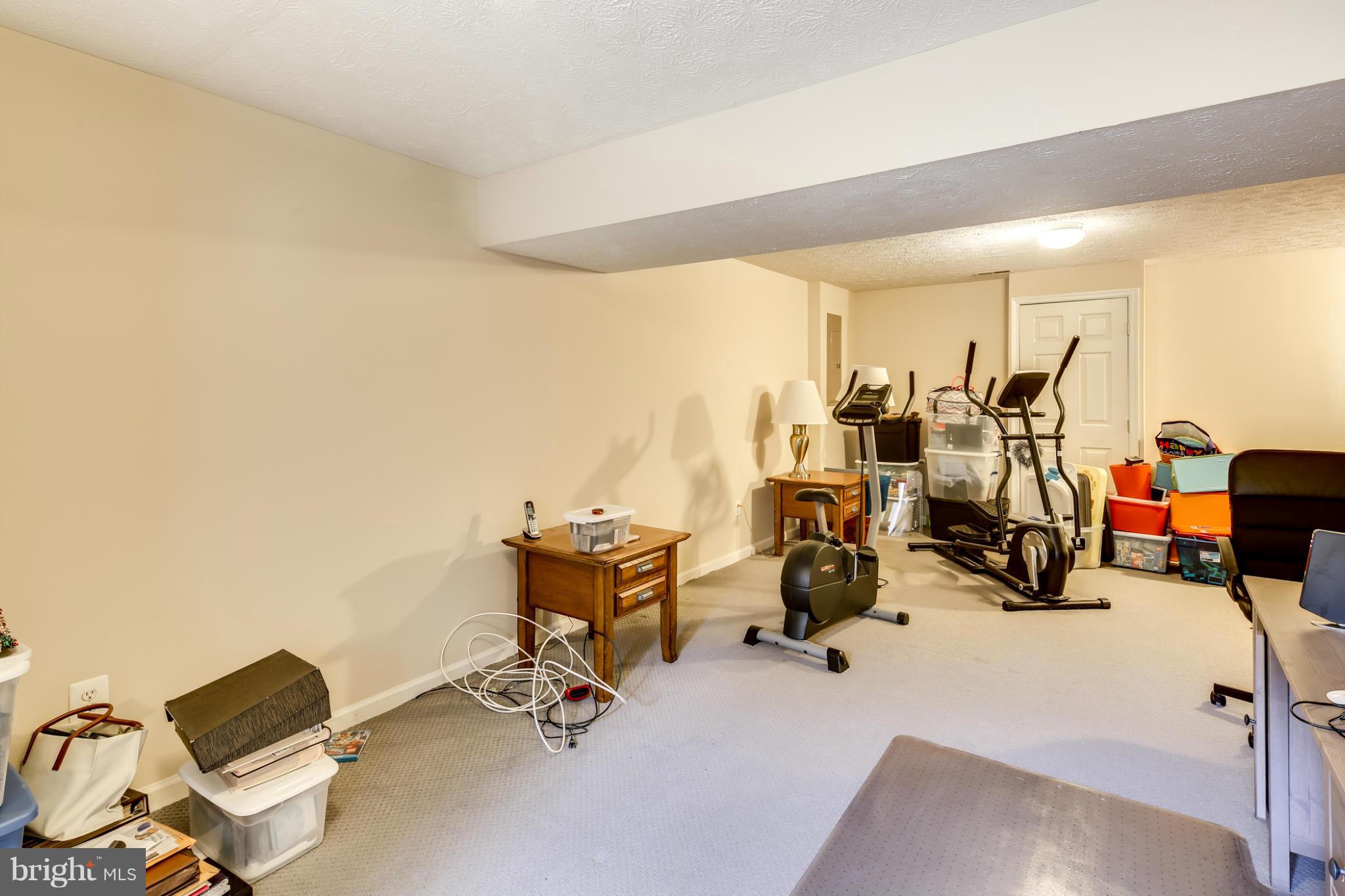 9539 Ridgeview Drive Columbia, MD 21046 - Photo 26 of 30 a view of a room with gym equipment