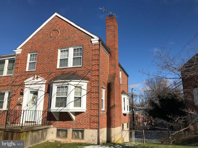1001 Harwall Road Baltimore, MD 21207 - Photo 2 of 109 a front view of a house with a yard