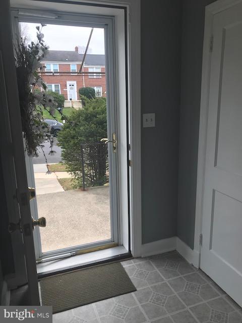 1001 Harwall Road Baltimore, MD 21207 - Photo 14 of 109 a view of a glass door with a yard from a window