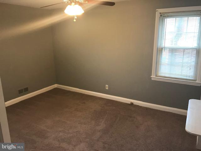 1001 Harwall Road Baltimore, MD 21207 - Photo 16 of 109 a view of an empty room with a window