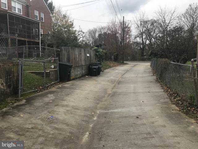 1001 Harwall Road Baltimore, MD 21207 - Photo 33 of 109 a view of a pathway with a wrought fence