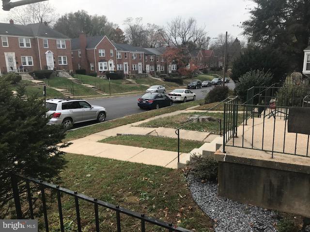 1001 Harwall Road Baltimore, MD 21207 - Photo 45 of 109 a view of a street with a car parked in front of it