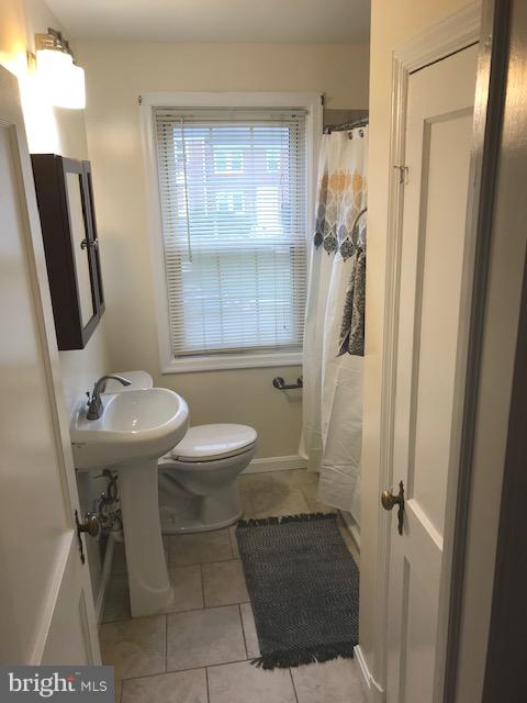 1001 Harwall Road Baltimore, MD 21207 - Photo 64 of 109 a bathroom with a sink toilet and shower