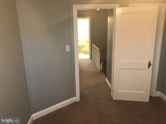 1001 Harwall Road Baltimore, MD 21207 - Photo 68 of 109 a view of a hallway with wooden floor