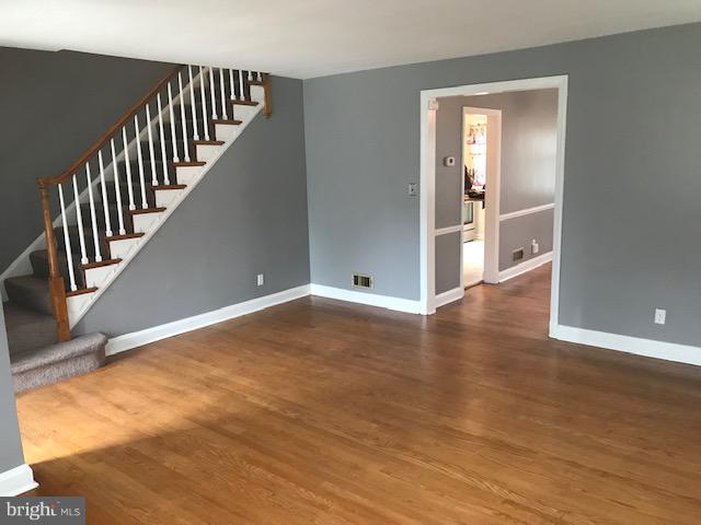 1001 Harwall Road Baltimore, MD 21207 - Photo 70 of 109 a view of a hallway with wooden floor and staircase