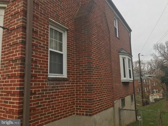1001 Harwall Road Baltimore, MD 21207 - Photo 8 of 109 a view of a brick building next to a yard