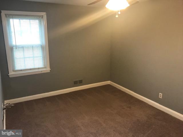 1001 Harwall Road Baltimore, MD 21207 - Photo 72 of 109 a view of an empty room with a window