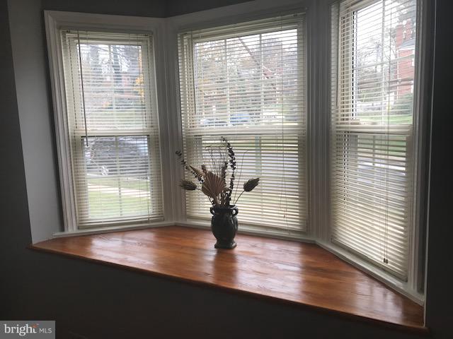 1001 Harwall Road Baltimore, MD 21207 - Photo 76 of 109 a view of empty room with wooden floor and floor to ceiling window